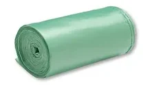 A roll of green plastic is sitting on the floor.